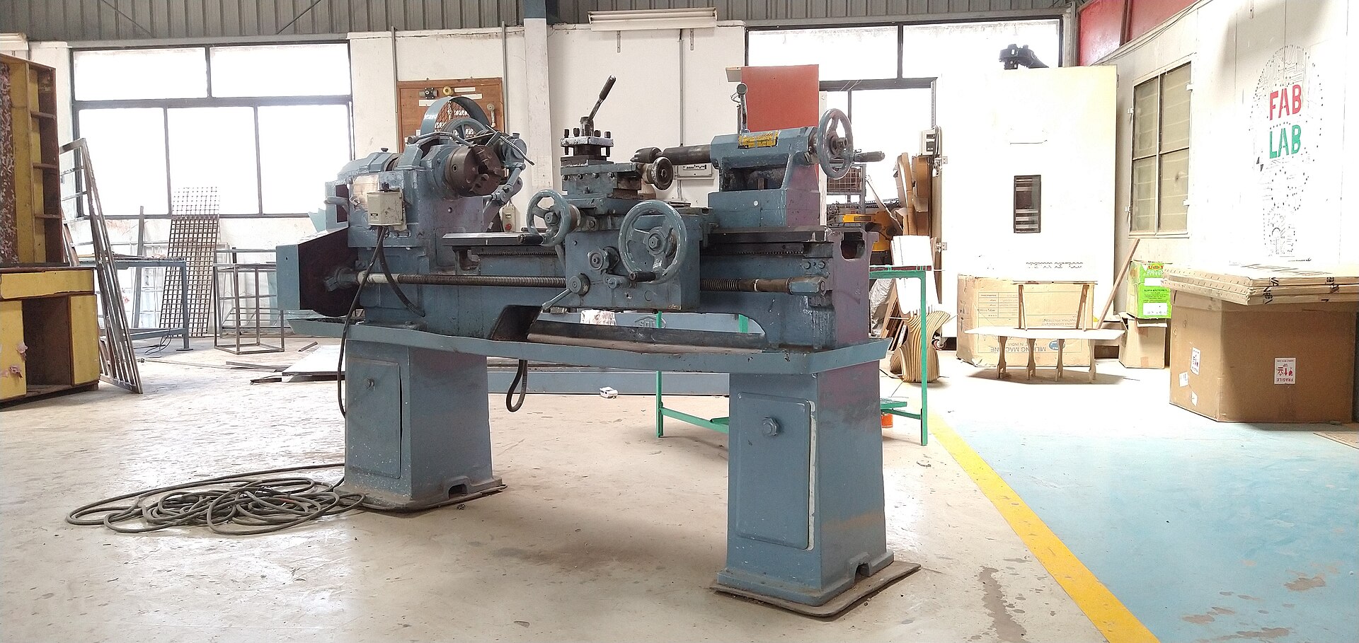 Metal lathe on a workshop floor